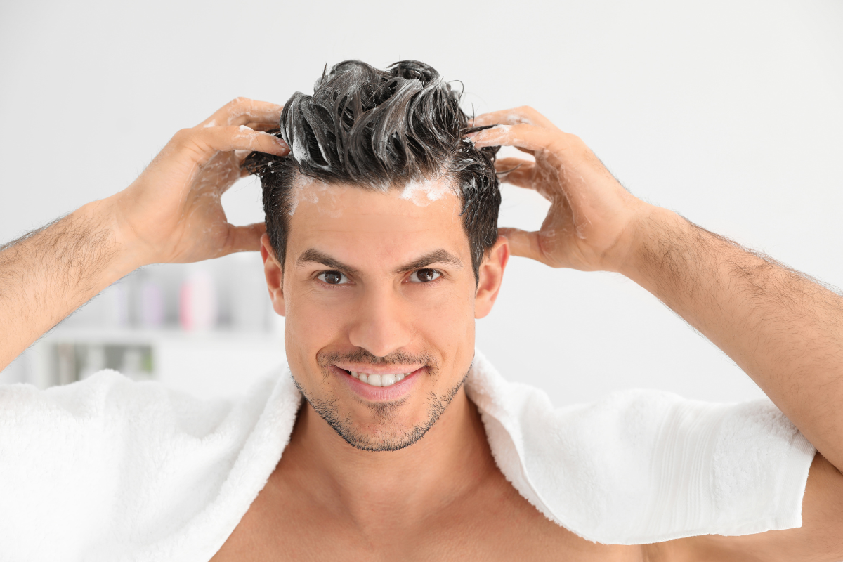 man moisturizing hair