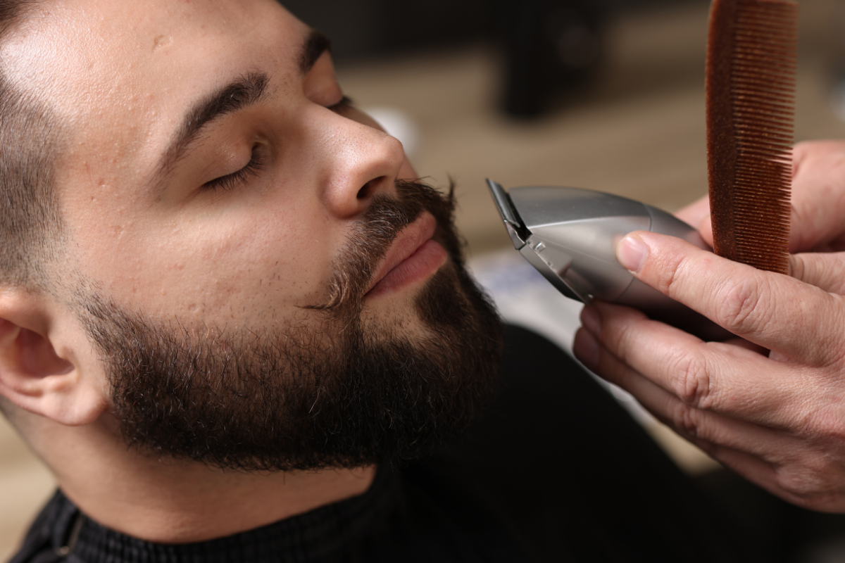 barber trimming mustache