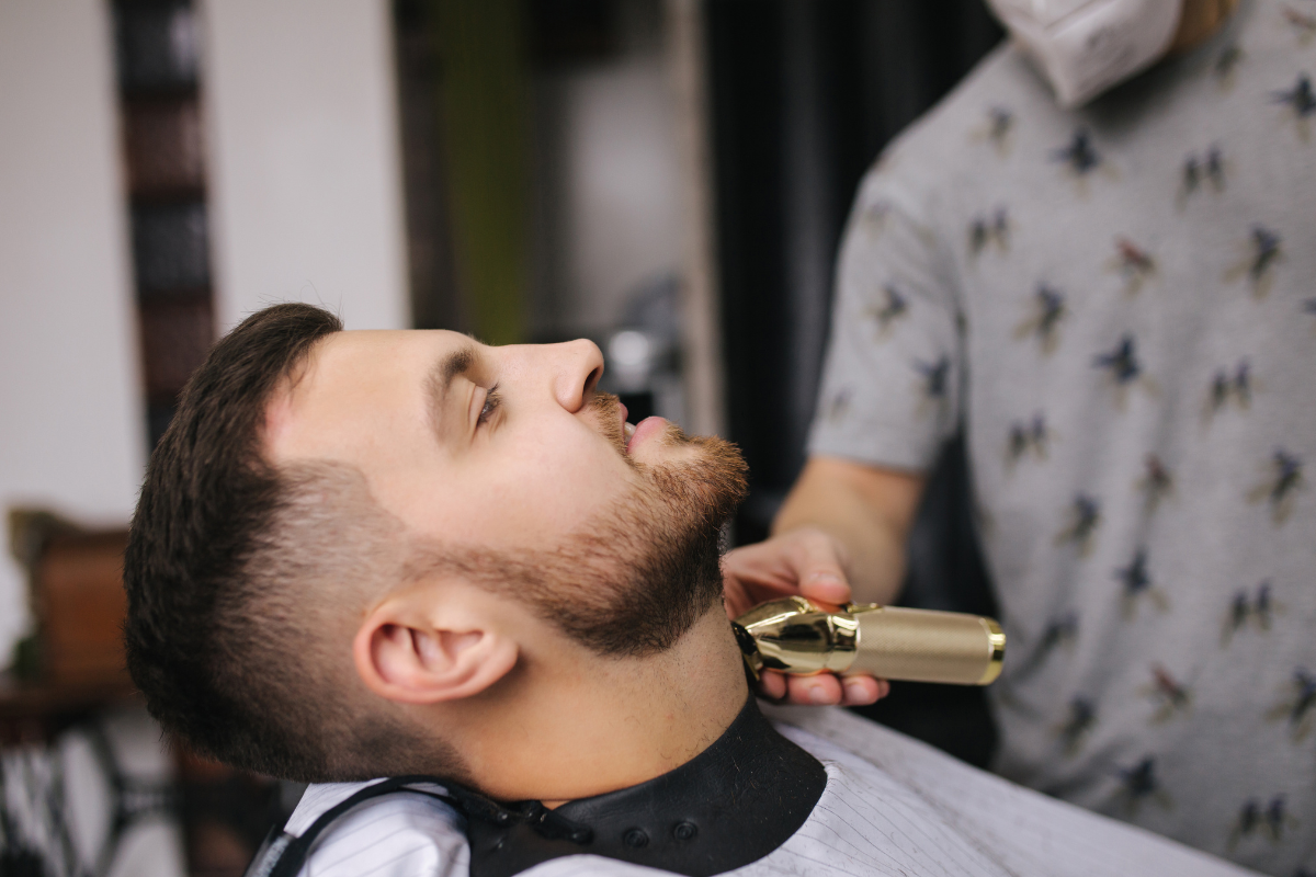 barber trimming mustache